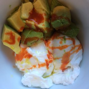 Breakfast:Poached eggs with avocado drizzled with olive oil and hot sauce