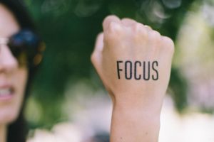 An updated approach to productivity: To-Be List Hand in fist with tatoo Focus